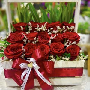 A basket with 15 roses